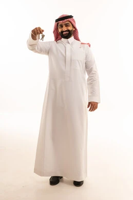 Saudi Man in Thobe Holding Keys on White Background