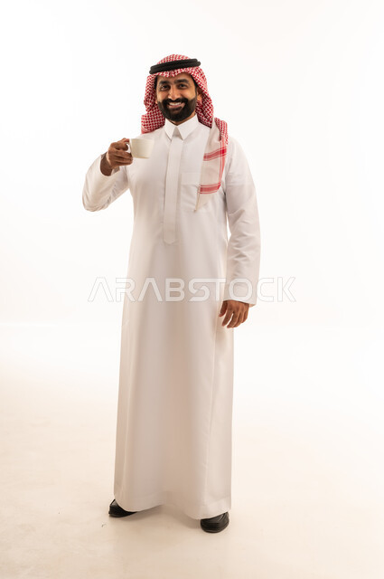 Saudi Man in Traditional Thobe Holding Coffee Cup
