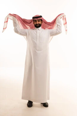 Saudi Man in White Thobe Adjusting Red Shemagh