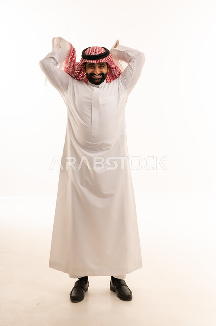 Saudi Man in Traditional Thobe Adjusting Shemagh