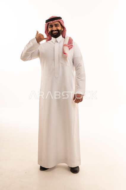 Saudi Man in Thobe Making Call Me Hand Gesture