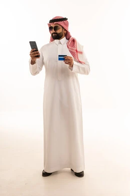 Saudi Man with Smartphone and Credit Card Online Shopping