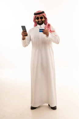 Saudi Man Using Smartphone and Credit Card White Background
