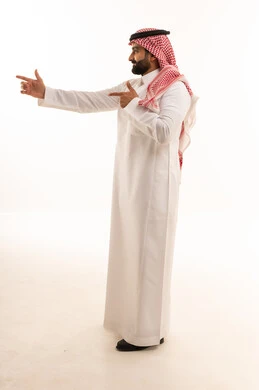 Saudi Man in Traditional Thobe Pointing Side View