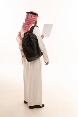 Saudi Man in Traditional Thobe Holding Paper with Backpack