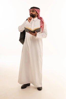 Saudi Man in Traditional Dress Holding Book and Backpack
