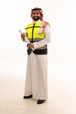 Saudi Engineer in Safety Vest Holding Blueprints