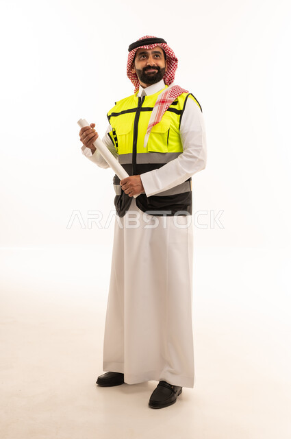 Saudi Engineer in Safety Vest Holding Blueprints