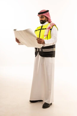 Saudi Engineer Holding Construction Blueprints in Studio