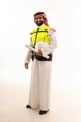 Saudi Professional Engineer Holding Blueprints in Studio