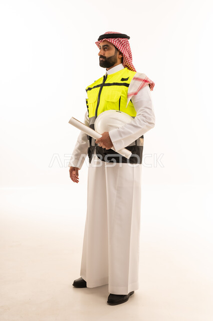Saudi Male Engineer with Blueprints on White Background