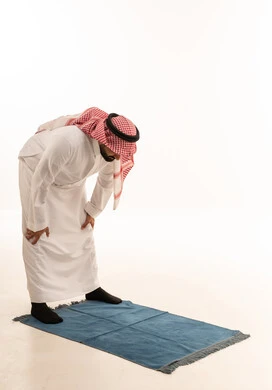 Saudi Man Performing Ruku Prayer on White Background