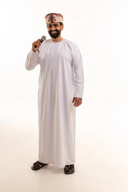 Omani Man in Traditional Dress with Microphone