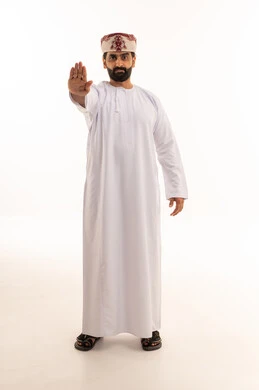 Omani Man in Traditional Dress Making Stop Gesture
