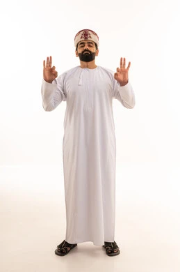Omani Man in Traditional Dress Meditating