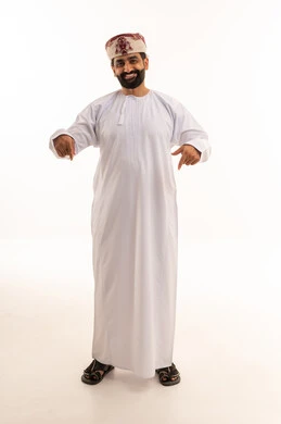 Smiling Omani Man Pointing Downward on White Background