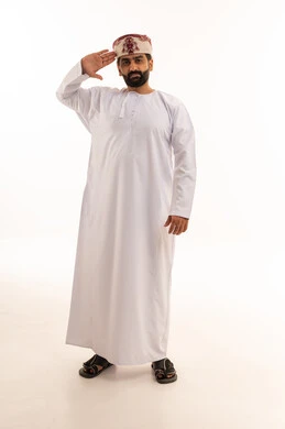 Omani Man in Traditional Dress Saluting on White