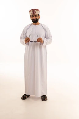 Omani Man in Traditional Dishdasha and Kummah