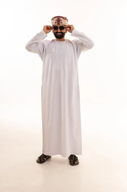 Omani Man in Traditional Dishdasha and Sunglasses