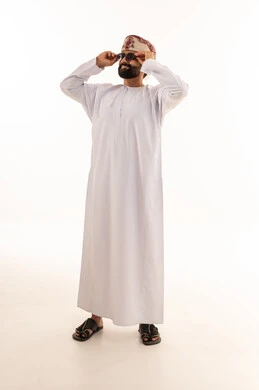 Omani Man in Traditional Dress with Sunglasses