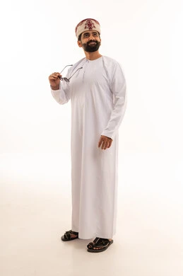 Omani Man in Traditional Dishdasha and Kumma