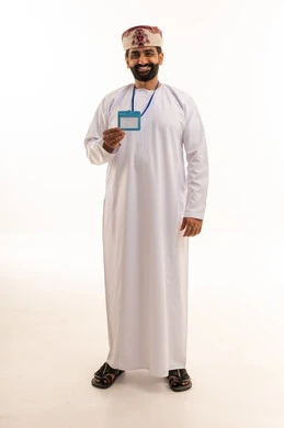 Omani Man in Traditional Dishdasha Holding ID Badge