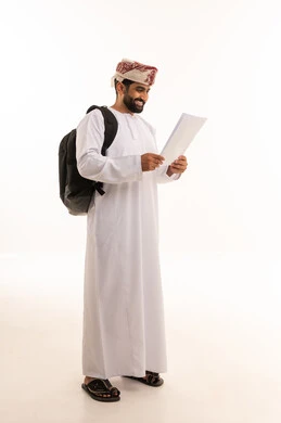 Omani Man in Traditional Dress Holding Paper