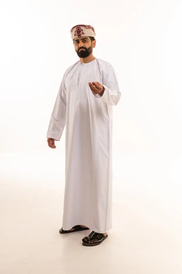 Omani Man in Traditional Dress with Hand Gesture