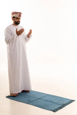 Omani Man Supplicating on Prayer Mat White Background