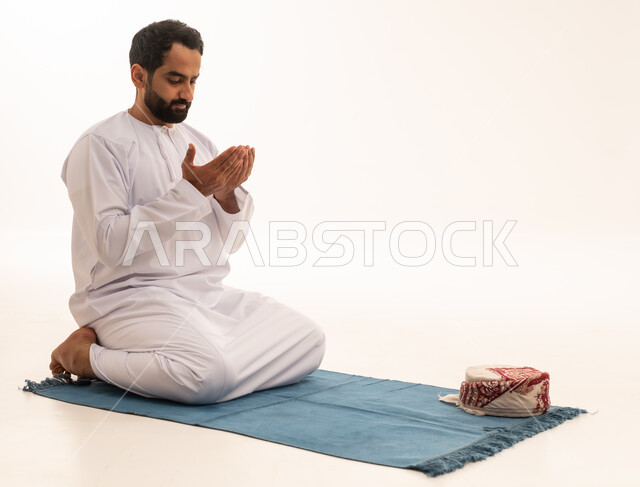 Emirati Man Praying Supplication on White Background