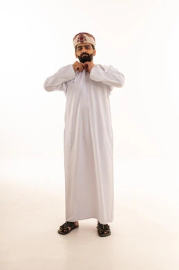 Omani Man in Traditional Dishdasha and Kummah