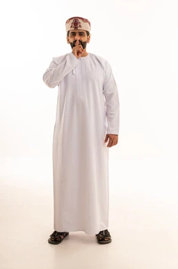Omani Man in Traditional Dress Making Silence Gesture