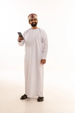 Omani Man in Traditional Dress with Smartphone Studio