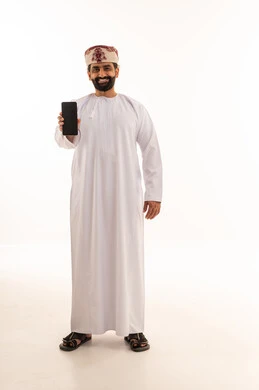 Omani Man in Traditional Dress Holding Smartphone