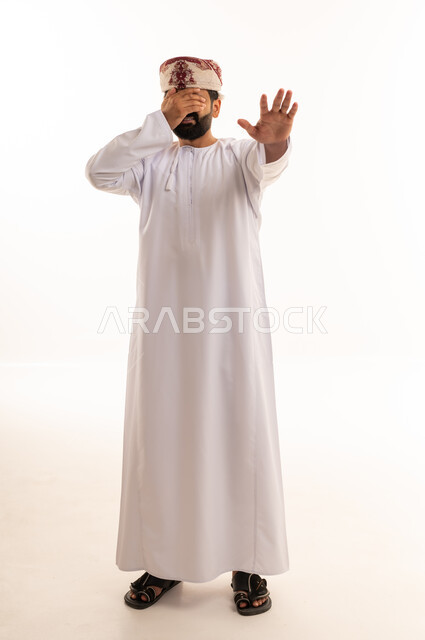 Omani Man in Traditional Dress Making Stop Gesture