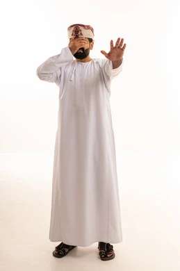 Omani Man in Traditional Dress Making Stop Gesture