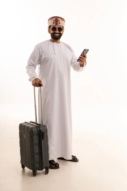Omani Man with Suitcase and Smartphone on White Background