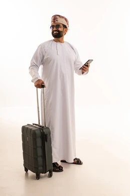 Omani Man with Suitcase and Smartphone on White Background