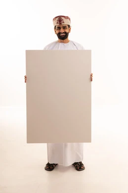 Omani Man Holding Blank White Sign in Studio