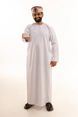 Omani Man in Traditional Dress Holding Blank Card