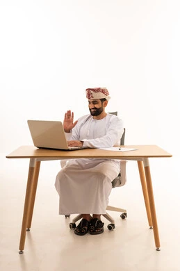 Omani Man Using Laptop for Video Call