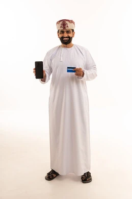 Omani Man Holding Smartphone and Credit Card in Studio