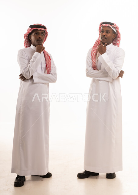 Saudi Men in Traditional Attire Thinking Pose