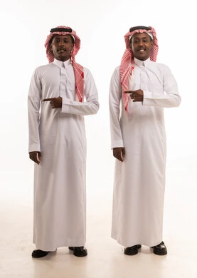 Two Saudi Men in Traditional Thobe Pointing in Studio