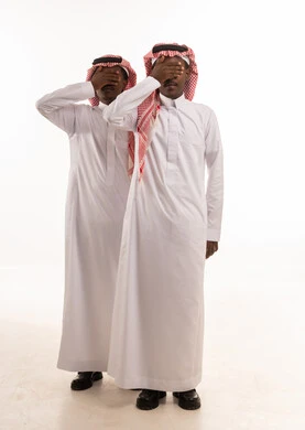 Saudi Men in Traditional Thobe Covering Eyes Studio