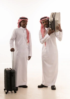 Two Saudi Men with Suitcases for Travel Studio Shot