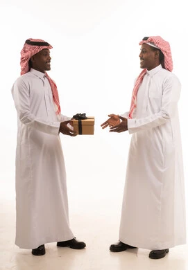 Saudi Men Exchanging Gift Box on Plain White Background