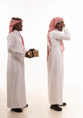 Saudi Men in Traditional Dress Giving Surprise Gift