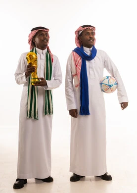 Saudi Men with World Cup Trophy and Football