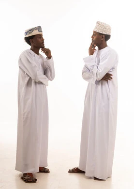 Omani Men in Traditional Dress Thinking in Studio